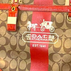 Coach tote with coach symbols and leather